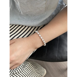 Minimalist S925 sterling silver beaded bracelet for women on a model's wrist