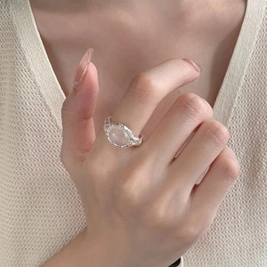S925 sterling silver ring with oval pink gemstone and irregular textured metal band