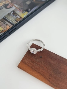 Detailed macro of S925 sterling silver ring with square halo setting and inner S925 stamp