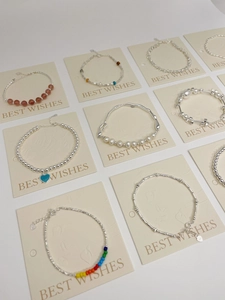 Detail of S925 sterling silver beaded bracelets with pearls and colorful heart charms