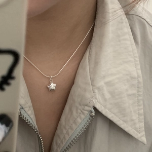 Close-up of S925 silver necklace featuring a lucky star pendant with a cute smiley face