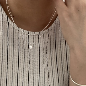 Minimalist S925 sterling silver layered necklace with a clear teardrop pendant and bead chain