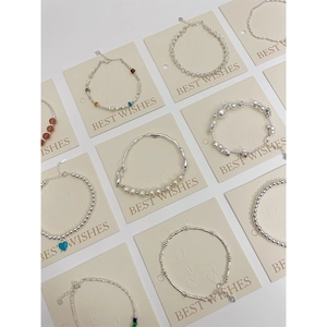 Collection of S925 sterling silver bracelets with pearls and beads on display cards