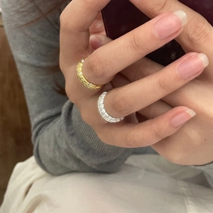 Detailed view of gold and silver S925 sterling silver wheat rings with crystal stones