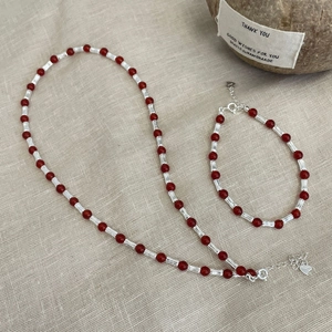 Detail of S925 sterling silver jewelry set with red agate beads and lobster clasp