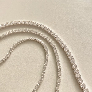 Detail view of S925 sterling silver tennis bracelets with shiny cubic zirconia in three sizes