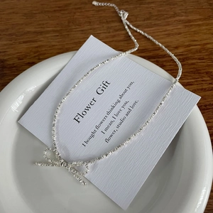 S925 sterling silver bowknot necklace with crushed silver chain design on white card