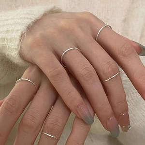 Stackable S925 sterling silver rings set with hammered texture worn on hand