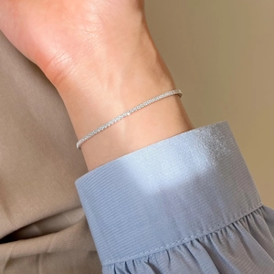 Elegant S925 sterling silver tennis bracelet with cubic zirconia on female wrist