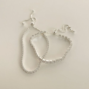 Close-up of S925 sterling silver tennis bracelets with cubic zirconia and slide clasp