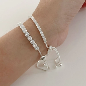 Detail of S925 sterling silver bracelets with cubic zirconia and adjustable slide closure
