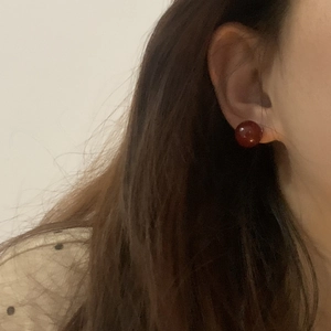 Minimalist S925 sterling silver red agate ball stud earrings worn on female ear
