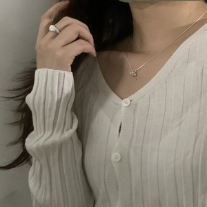 Minimalist S925 sterling silver beaded necklace with round pendant on a knit cardigan model
