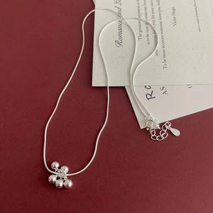 Detailed close-up of S925 sterling silver necklace featuring polished grape bead pendant