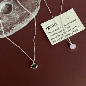 925 silver geometric oval necklaces with green and pink gemstones on elegant background