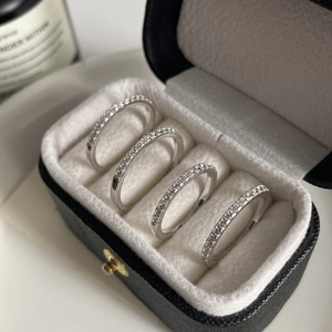 Set of four 925 sterling silver eternity rings with cubic zirconia in a black gift box