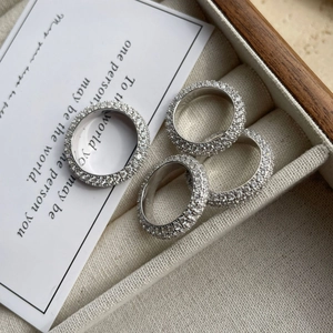 Elegant 925 silver eternity rings set with multi-row pavé crystals on a velvet base
