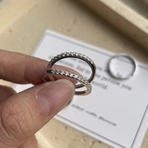 Macro shot of 925 sterling silver stacking rings with sparkling zircon pavé setting