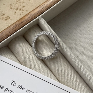 Macro shot of 925 silver full eternity band ring with micro-pave sparkling crystals