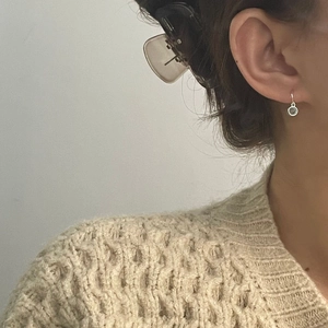 Minimalist S925 silver round drop earrings with translucent gemstone on a model ear