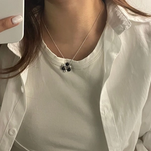 Minimalist S925 silver necklace with black and silver beads worn on a neck