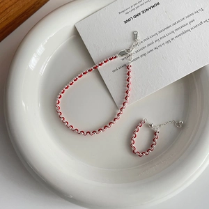 Detail of S925 sterling silver red cord bracelet set with beads and lobster clasp