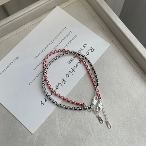 Paire de bracelets tressés en argent 925 avec cordons rouge et noir élégants