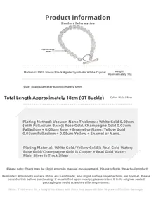 Detail of S925 silver infinity bracelet with 6mm white crystal and black agate beads