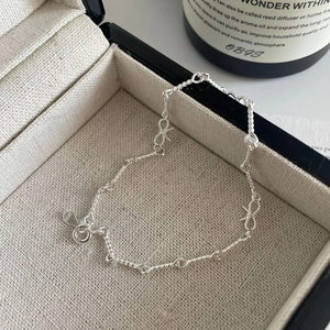 Bracelet élégant en argent sterling S925 avec nœud papillon et chaîne torsadée délicate