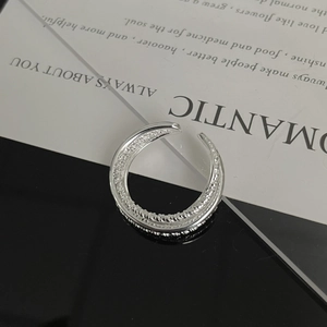 Macro shot of S925 sterling silver multilayer twisted ring with polished metallic finish