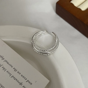 Detail of S925 sterling silver ear cuff with multi-layer textured and smooth finish