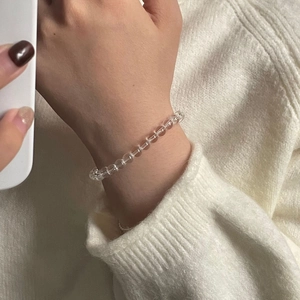 Detailed view of S925 sterling silver bracelet with transparent white crystal beads