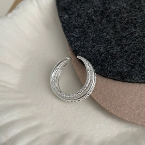Detailed macro view of S925 sterling silver ear cuff with double-layer textured lines