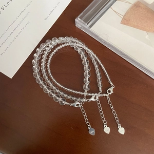 Detail of S925 sterling silver heart charm and extension chain on clear crystal bracelet