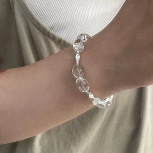 Elegant S925 sterling silver beaded bracelet with clear crystal stones on female wrist