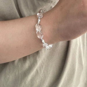Detail view of S925 silver beaded bracelet featuring large clear crystal beads on a wrist