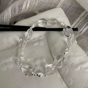 Detail of S925 sterling silver bracelet with clear oval crystals and silver beads