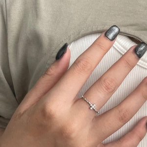 Minimalist S925 sterling silver cross ring with crystals shown on a model's finger