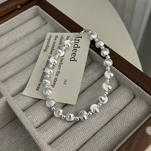 Minimalist 925 sterling silver beaded bracelet with brushed texture on jewelry box