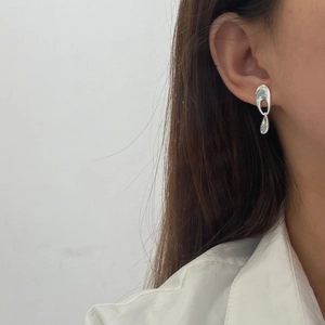 Minimalist 925 sterling silver hollow oval earrings with sleek liquid metal drop on model