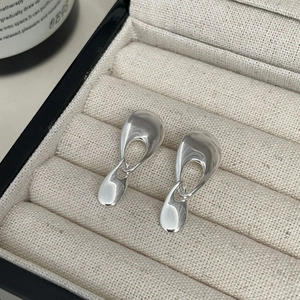 Abstract silver liquid teardrop earrings with minimalist irregular hollow design for women