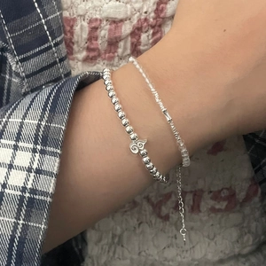 Macro shot of 925 sterling silver beaded bracelet with clear crystal accents