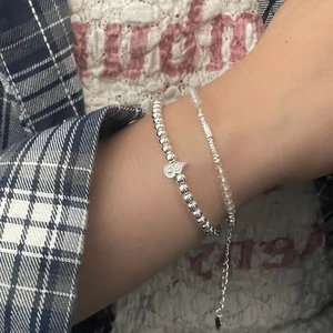 S925 silver layered bracelet set with heart charm and clear beads on wrist