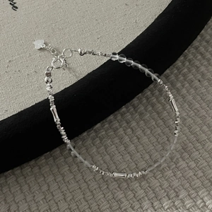 Detailed view of S925 sterling silver bamboo style bracelet with clear crystal beads