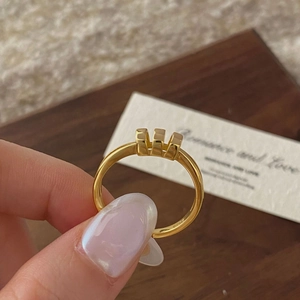Detailed close-up of S925 sterling silver gold ring with triple rectangular geometric shapes