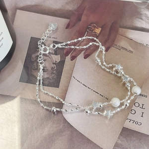 Detailed close-up of double-layer S925 silver star bracelet with frosted beads