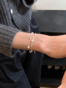 Close-up of double-layer S925 sterling silver star bracelet with frosted beads on wrist