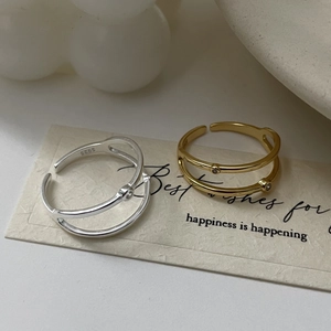 Detail showing S925 sterling silver hallmark on minimalist double-layer zircon rings