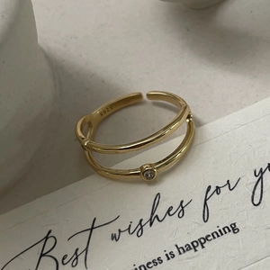 Detail view of S925 hallmark on minimalist double-layer gold plated silver ring with zircon