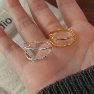 Close-up of S925 sterling silver double-layer rings with cubic zirconia and adjustable band